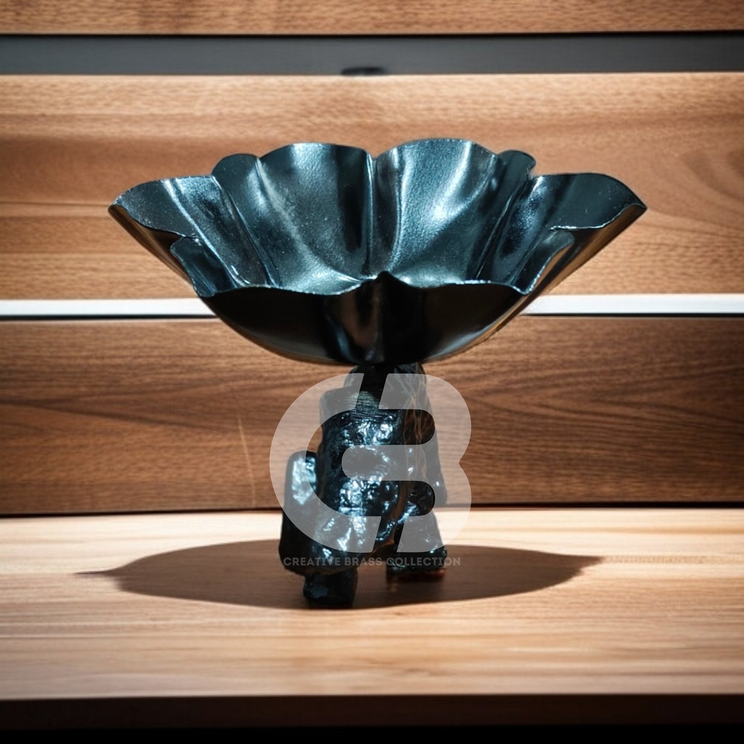 A high-resolution product shot of a handcrafted elephant bowl with colorful enamel details, used as a dry fruit dish. The elephant's trunk is raised in a symbol of good luck. Product code CB-ETLH01.